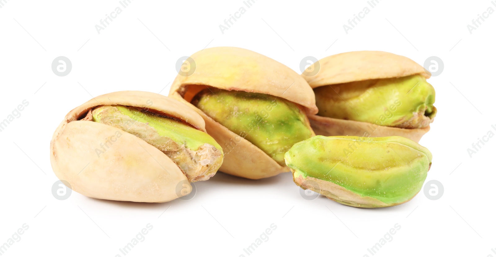 Photo of Many tasty pistachio nuts isolated on white