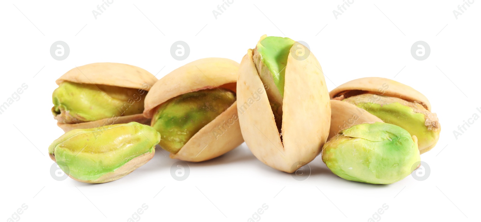 Photo of Many tasty pistachio nuts isolated on white