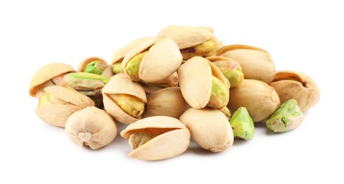 Photo of Heap of tasty pistachio nuts isolated on white