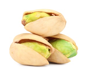 Photo of Three tasty pistachio nuts isolated on white