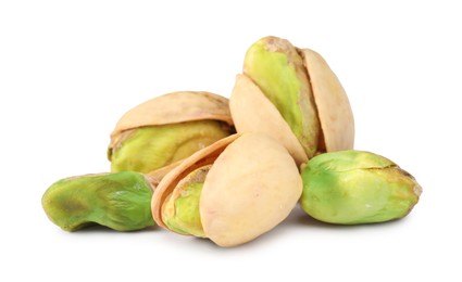 Many tasty pistachio nuts isolated on white