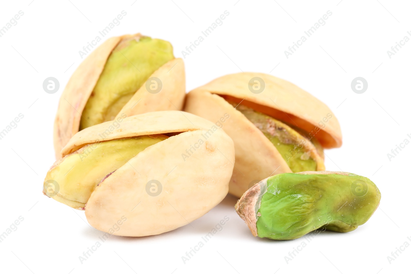 Photo of Many tasty pistachio nuts isolated on white