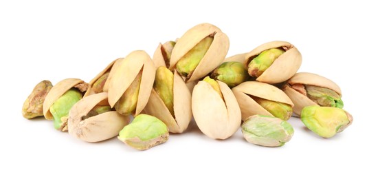 Photo of Heap of tasty pistachio nuts isolated on white