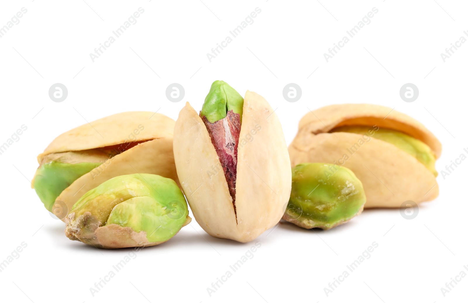 Photo of Many tasty pistachio nuts isolated on white