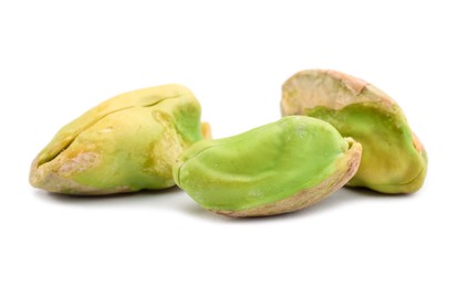 Photo of Tasty peeled pistachio nuts isolated on white