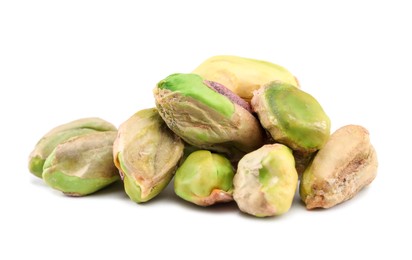 Tasty peeled pistachio nuts isolated on white