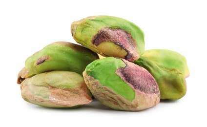 Tasty peeled pistachio nuts isolated on white