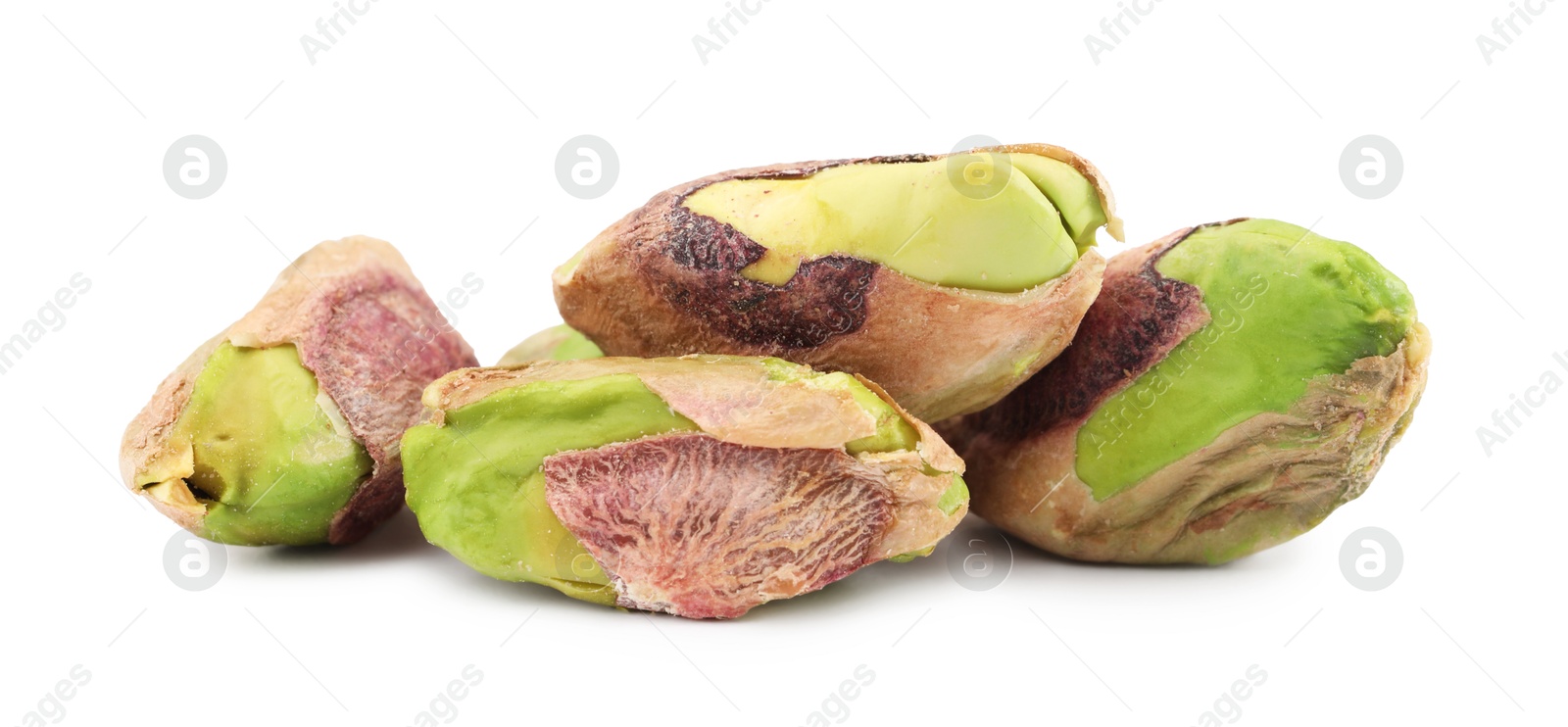 Photo of Tasty peeled pistachio nuts isolated on white