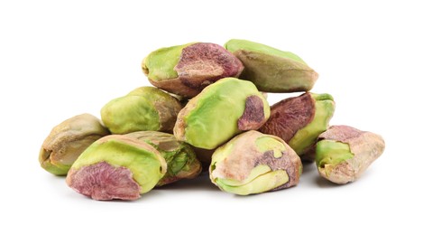 Tasty peeled pistachio nuts isolated on white