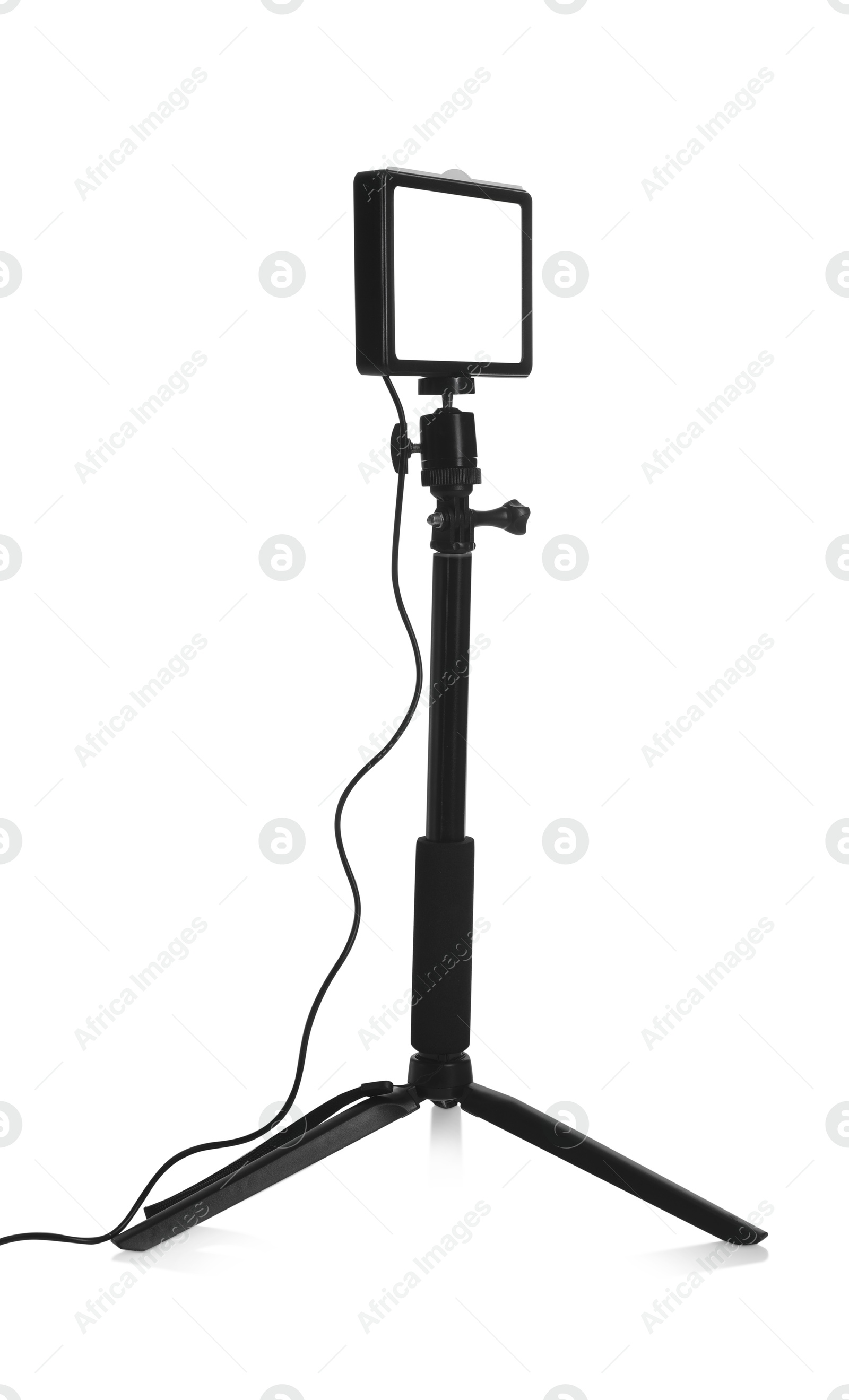 Photo of Professional lighting equipment with tripod isolated on white