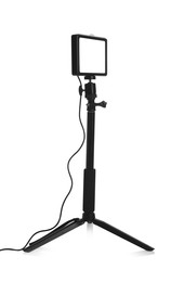 Photo of Professional lighting equipment with tripod isolated on white