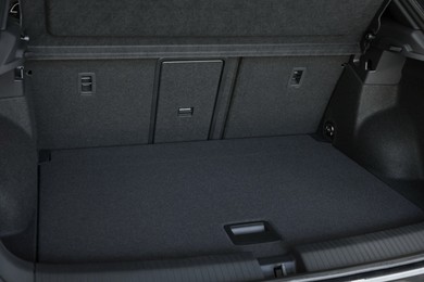 Photo of Grey soft car boot liner mat in trunk of auto