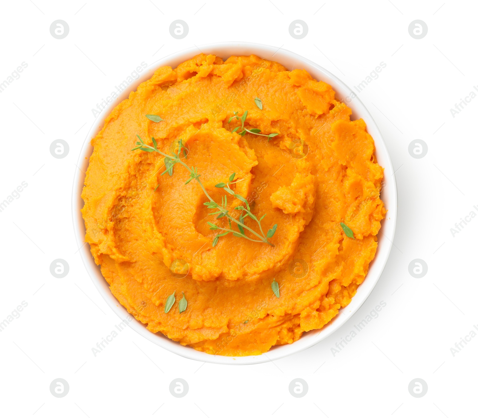 Photo of Delicious mashed sweet potatoes and microgreens in bowl isolated on white, top view