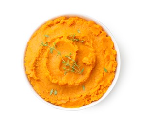 Photo of Delicious mashed sweet potatoes and microgreens in bowl isolated on white, top view