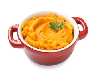 Photo of Delicious mashed sweet potatoes with parsley in pot isolated on white