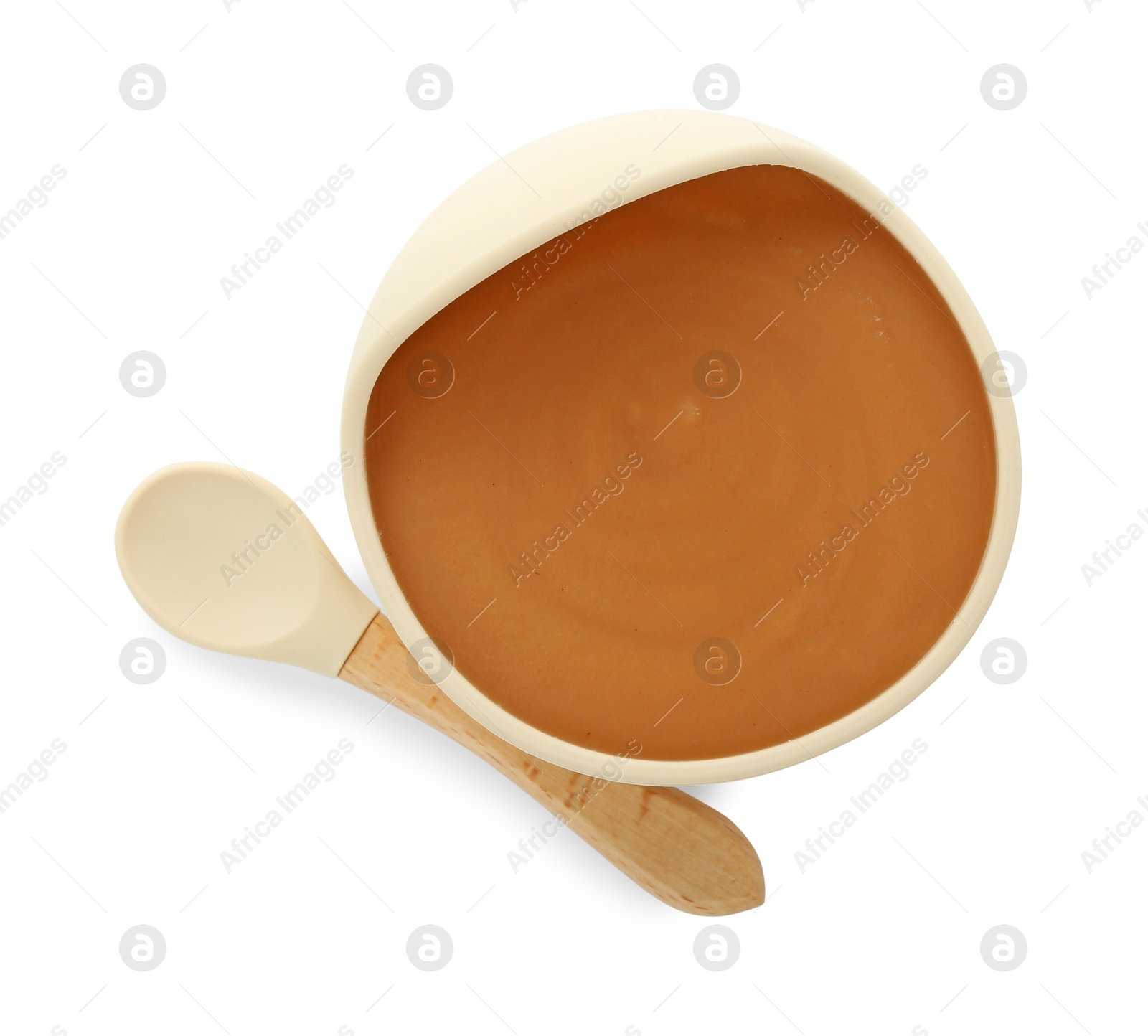 Photo of Tasty baby food in bowl and spoon isolated on white, top view