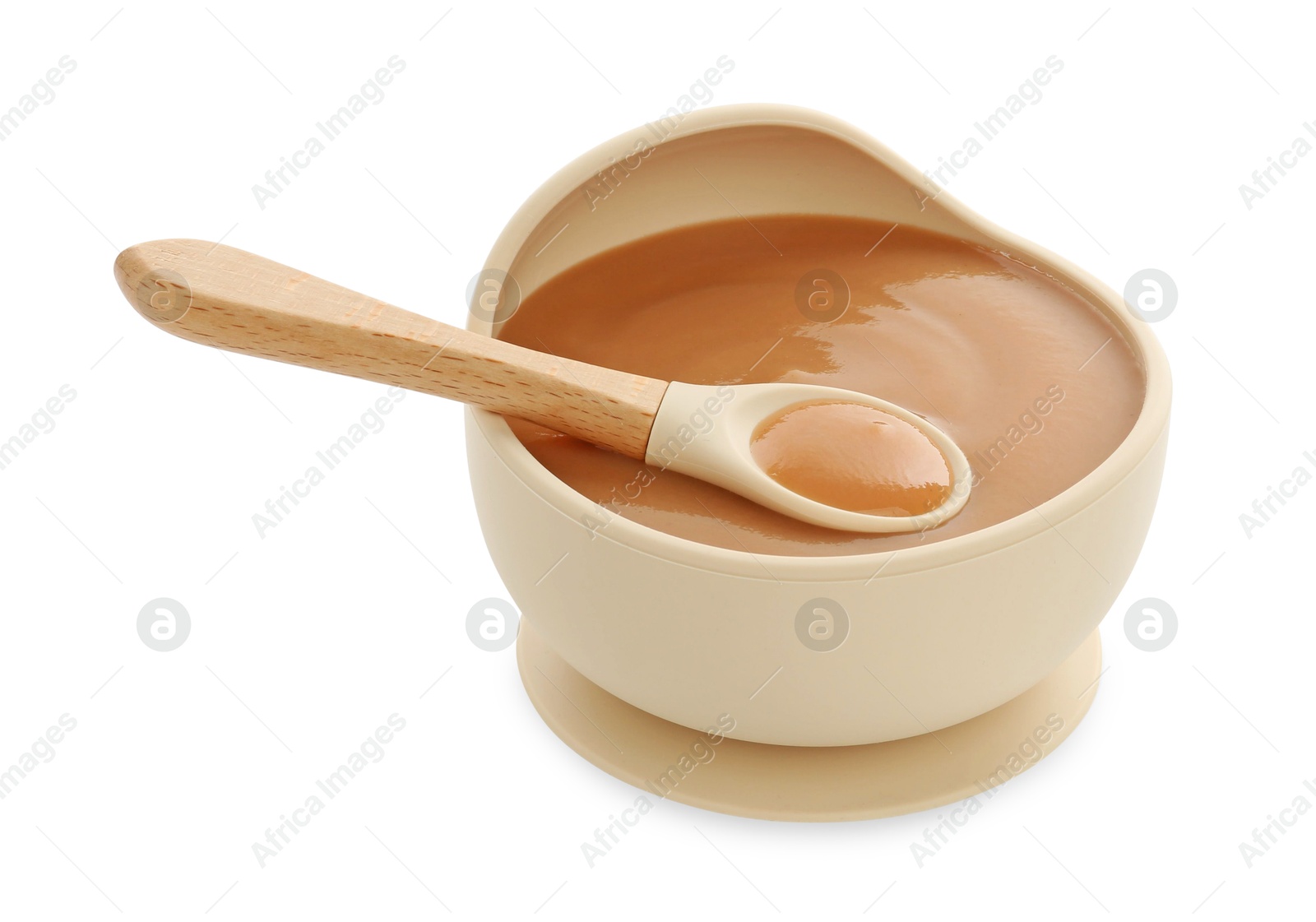 Photo of Tasty baby food in bowl and spoon isolated on white