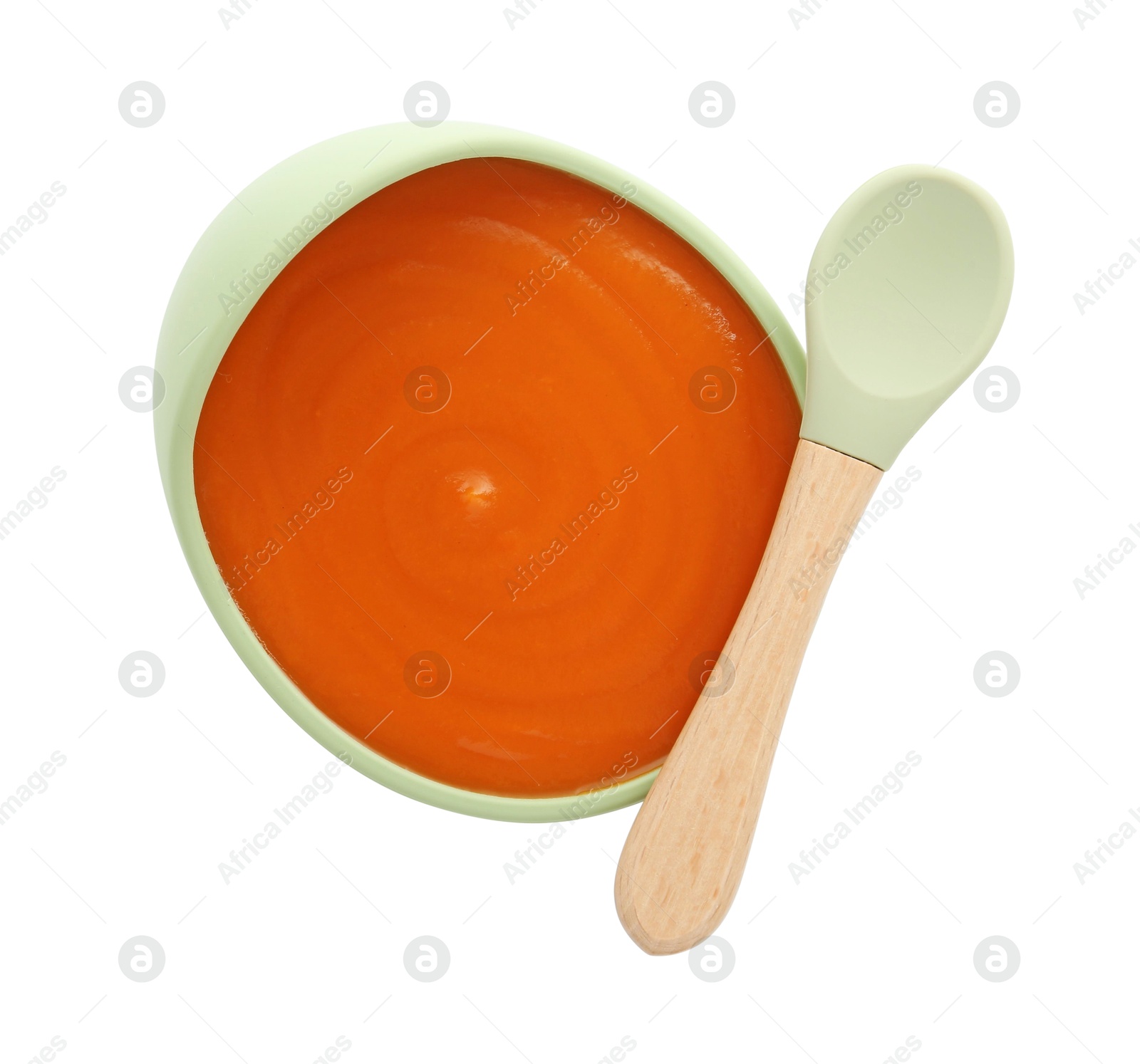 Photo of Tasty baby food in bowl and spoon isolated on white, top view