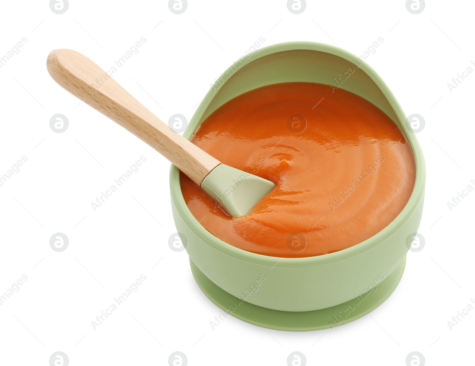 Photo of Tasty baby food and spoon in bowl isolated on white