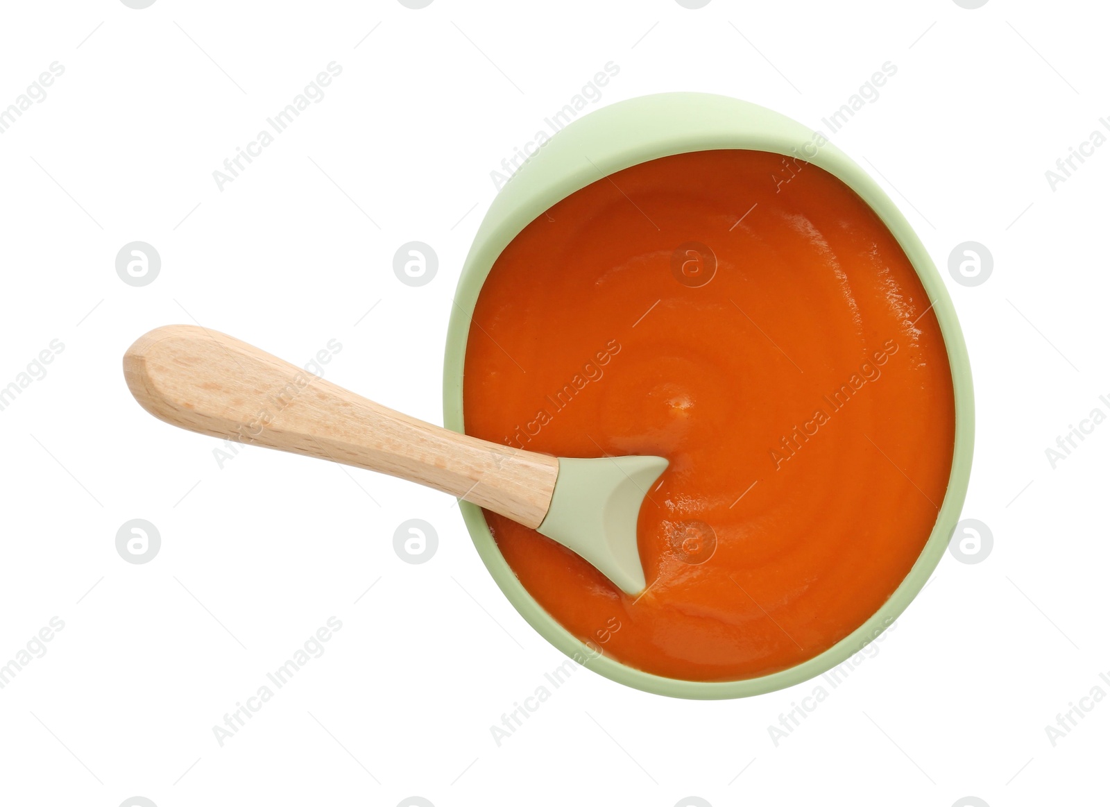 Photo of Tasty baby food in bowl and spoon isolated on white, top view