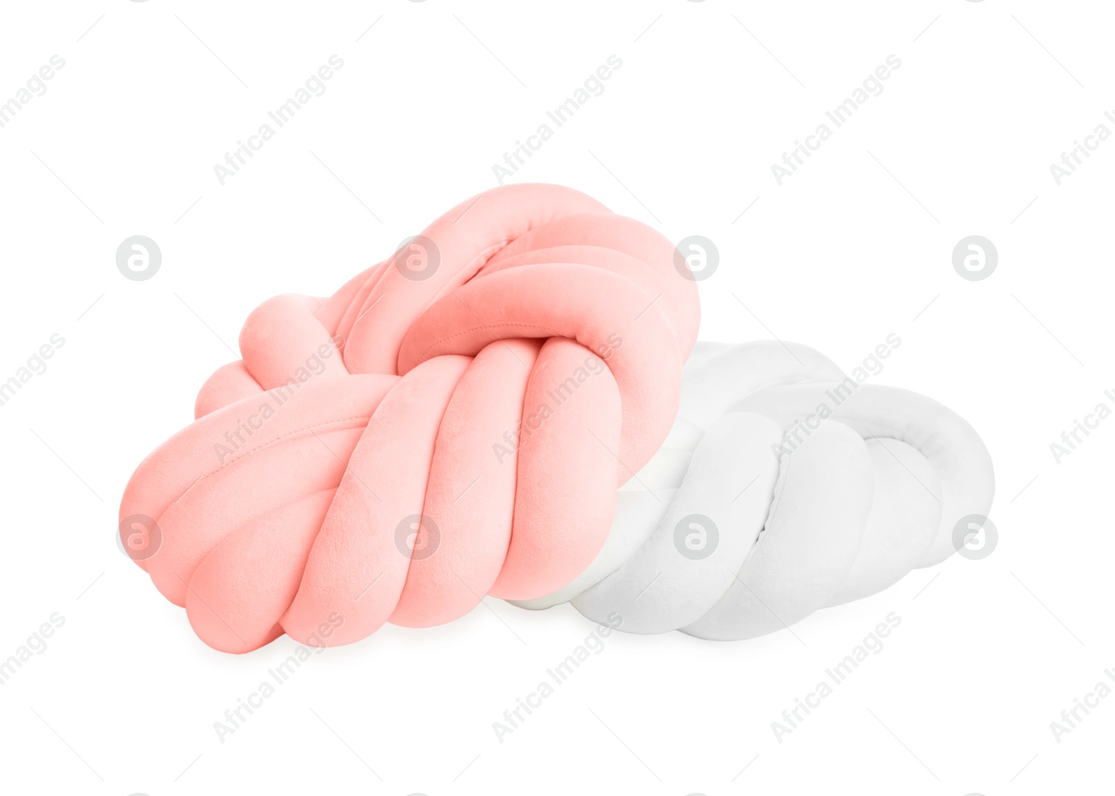 Photo of Two soft color pillows in shape of knots isolated on white