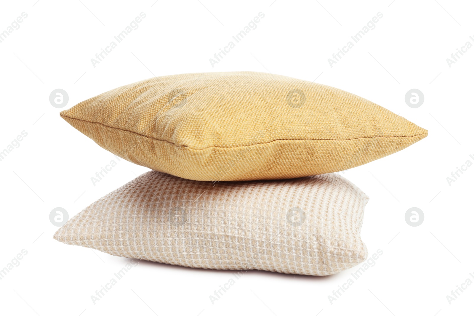 Photo of Stack of different pillows isolated on white