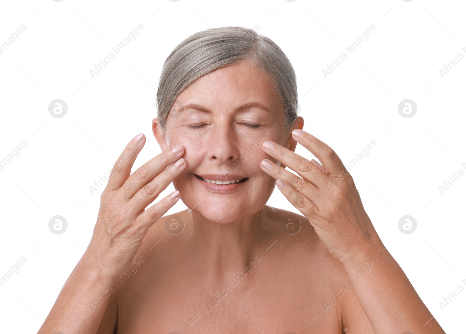 Photo of Beautiful woman doing facial massage on white background