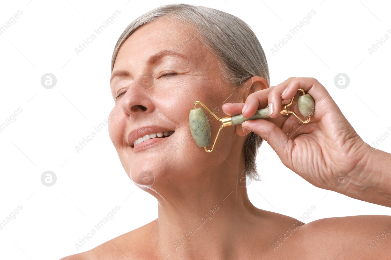 Photo of Beautiful woman doing facial massage with roller on white background