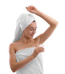 Photo of Smiling woman applying solid deodorant on white background