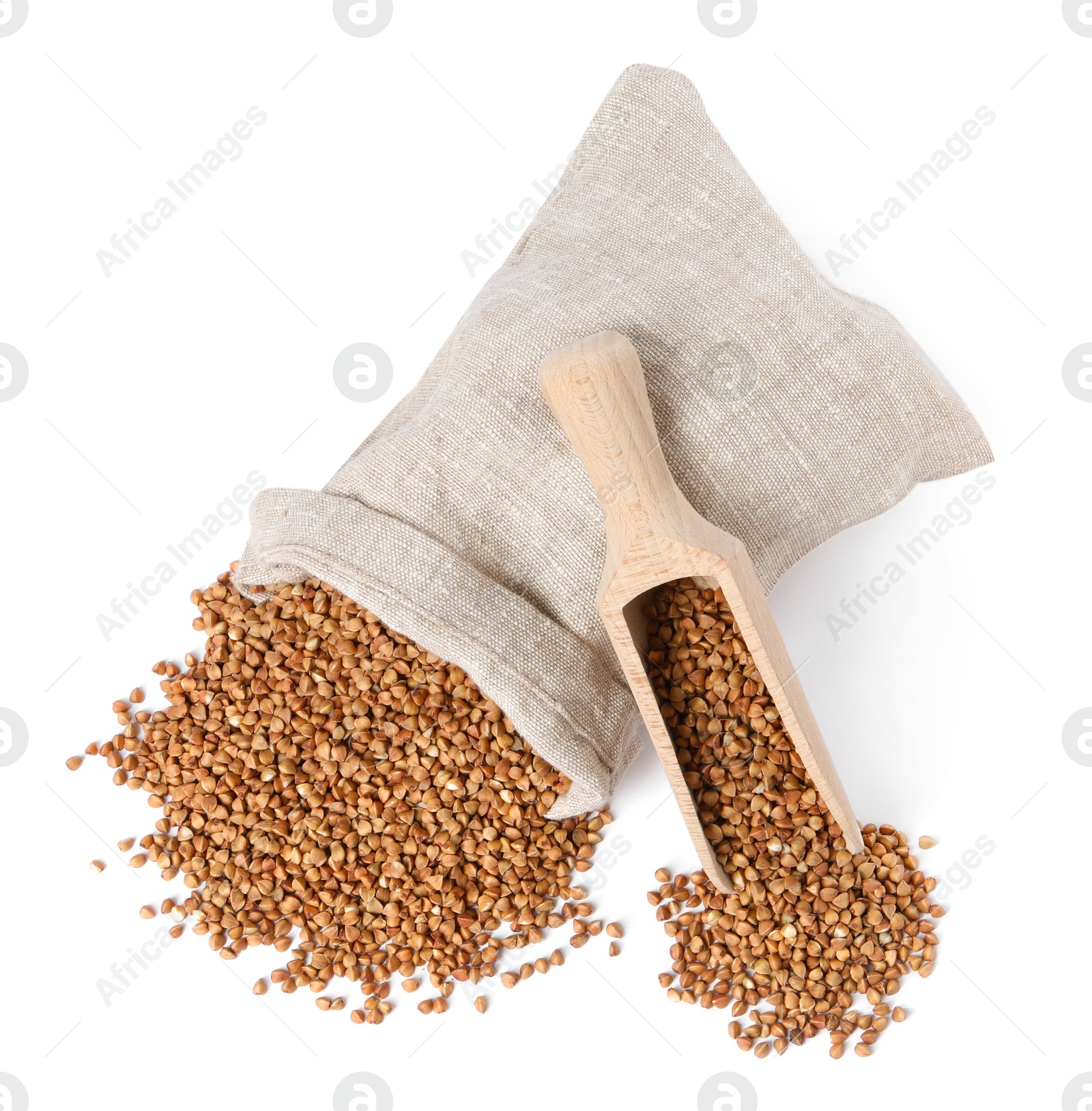 Photo of Raw buckwheat in burlap with scoop isolated on white, top view