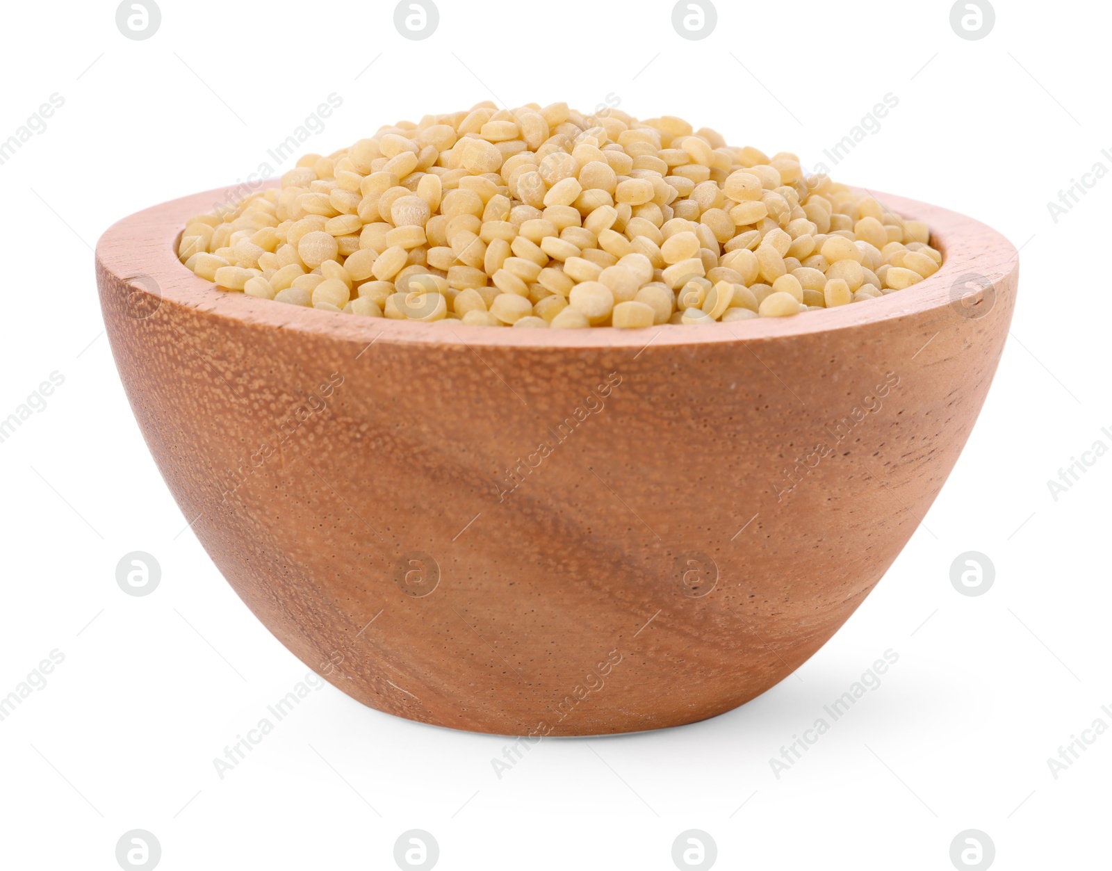 Photo of Raw couscous in wooden bowl isolated on white