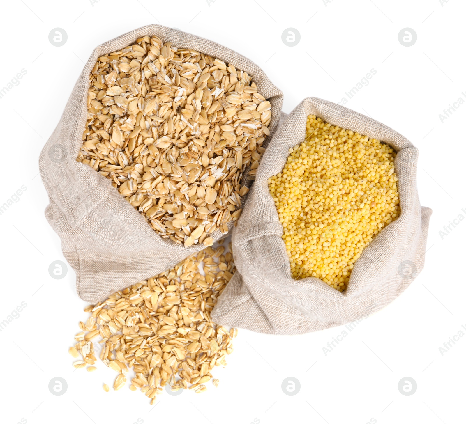 Photo of Different cereal grains in burlap sacks isolated on white, top view