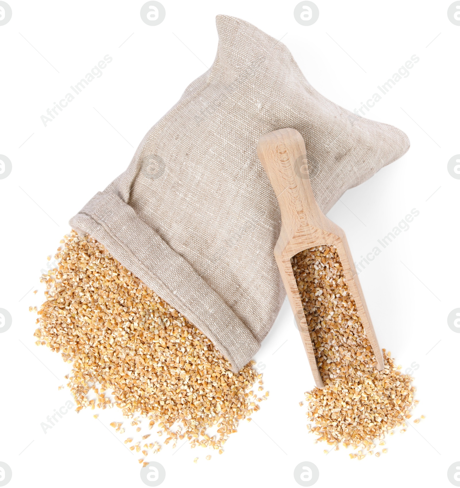 Photo of Dry wheat groats, overturned burlap sack and wooden scoop isolated on white, top view