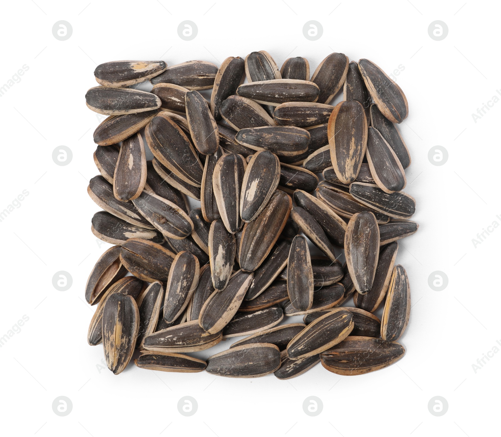 Photo of Pile of sunflower seeds isolated on white, top view