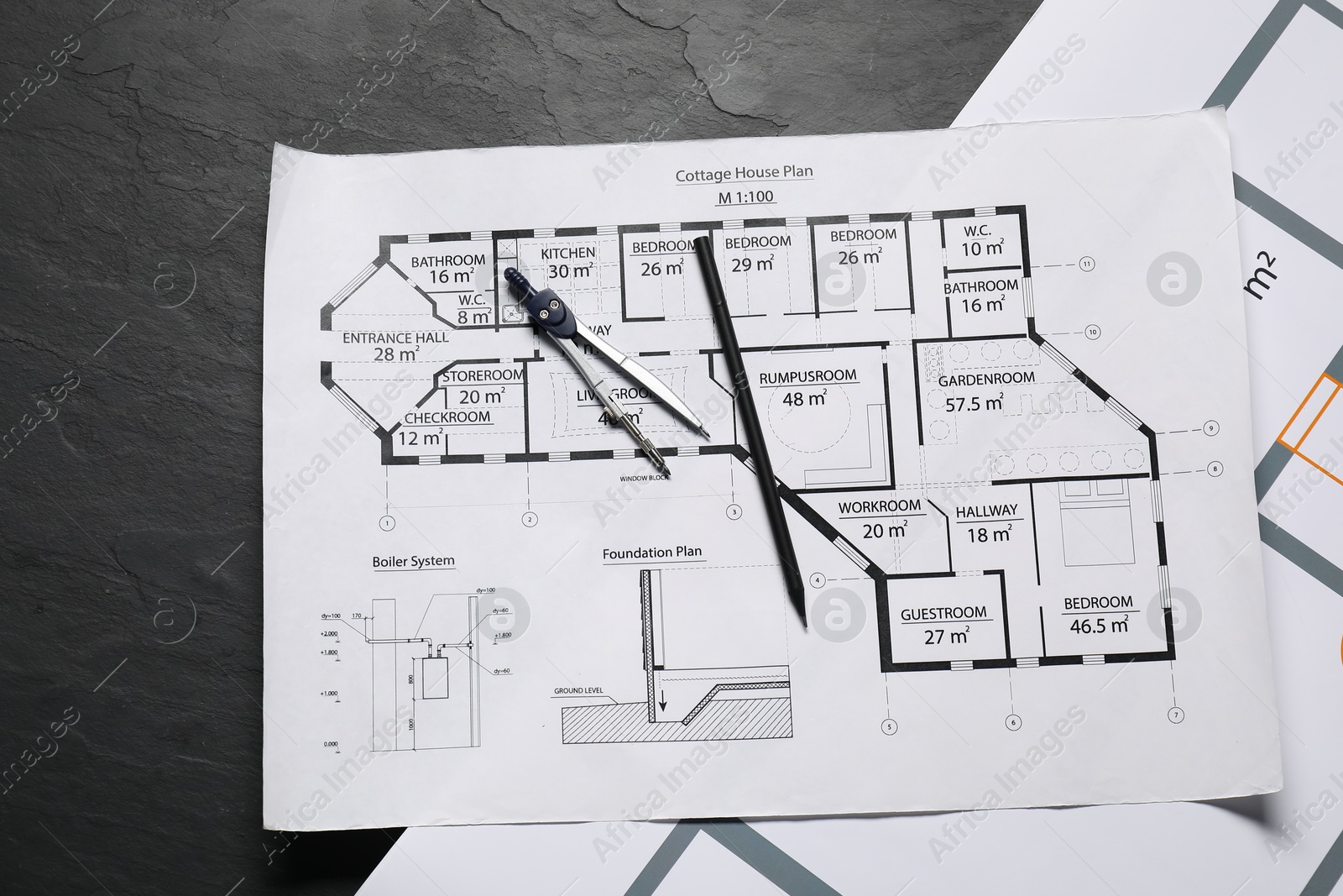 Photo of Different engineering drawings, pencil and divider on grey textured table, flat lay