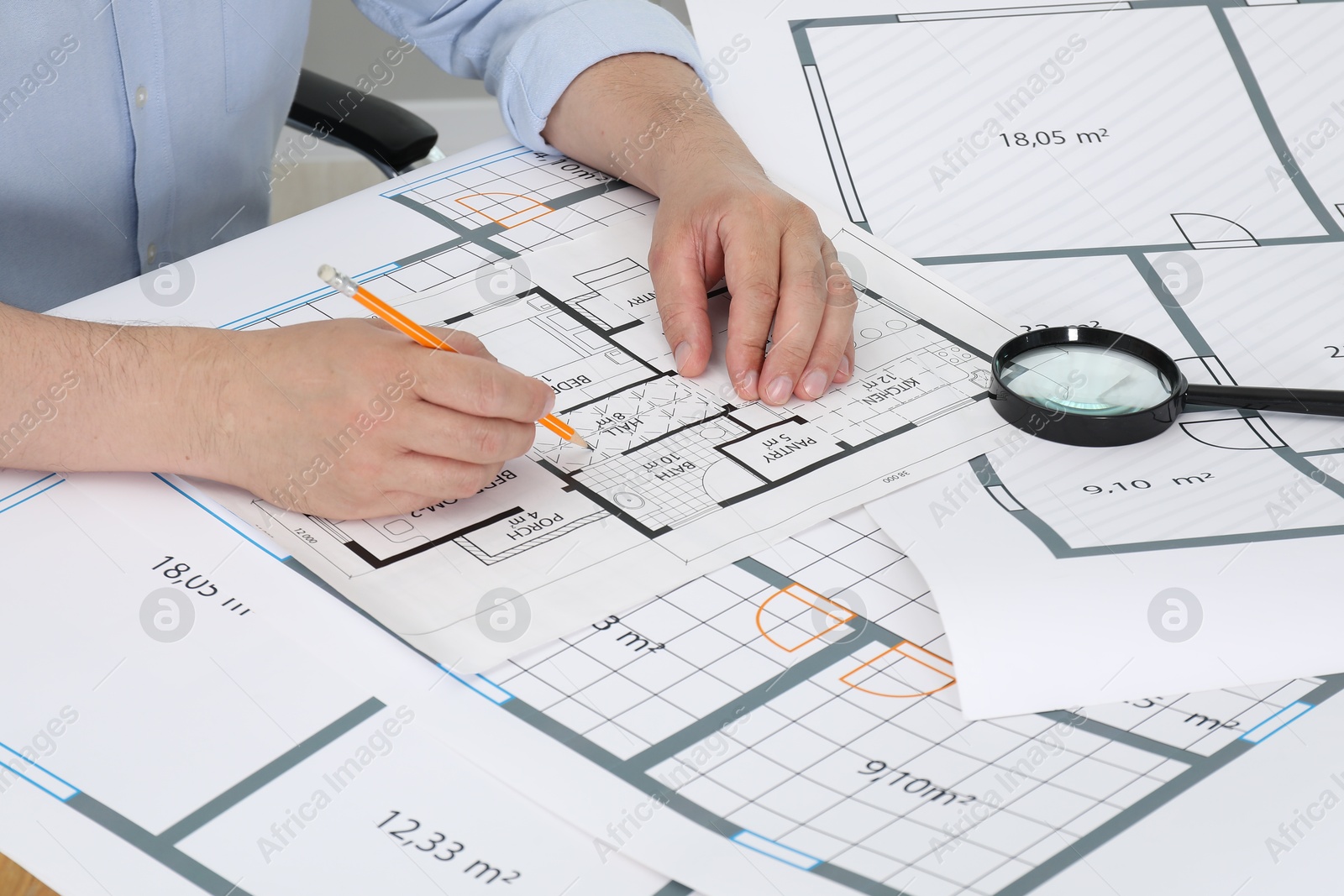 Photo of Architect working with project at table in office, closeup