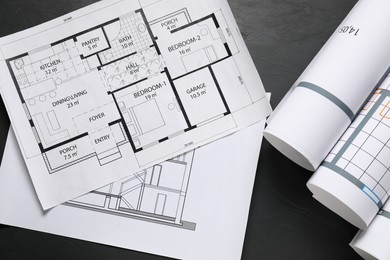 Photo of Different architectural drawings on grey textured table, flat lay