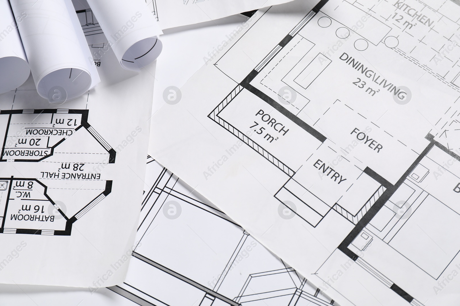 Photo of Different architectural drawings on table, flat lay