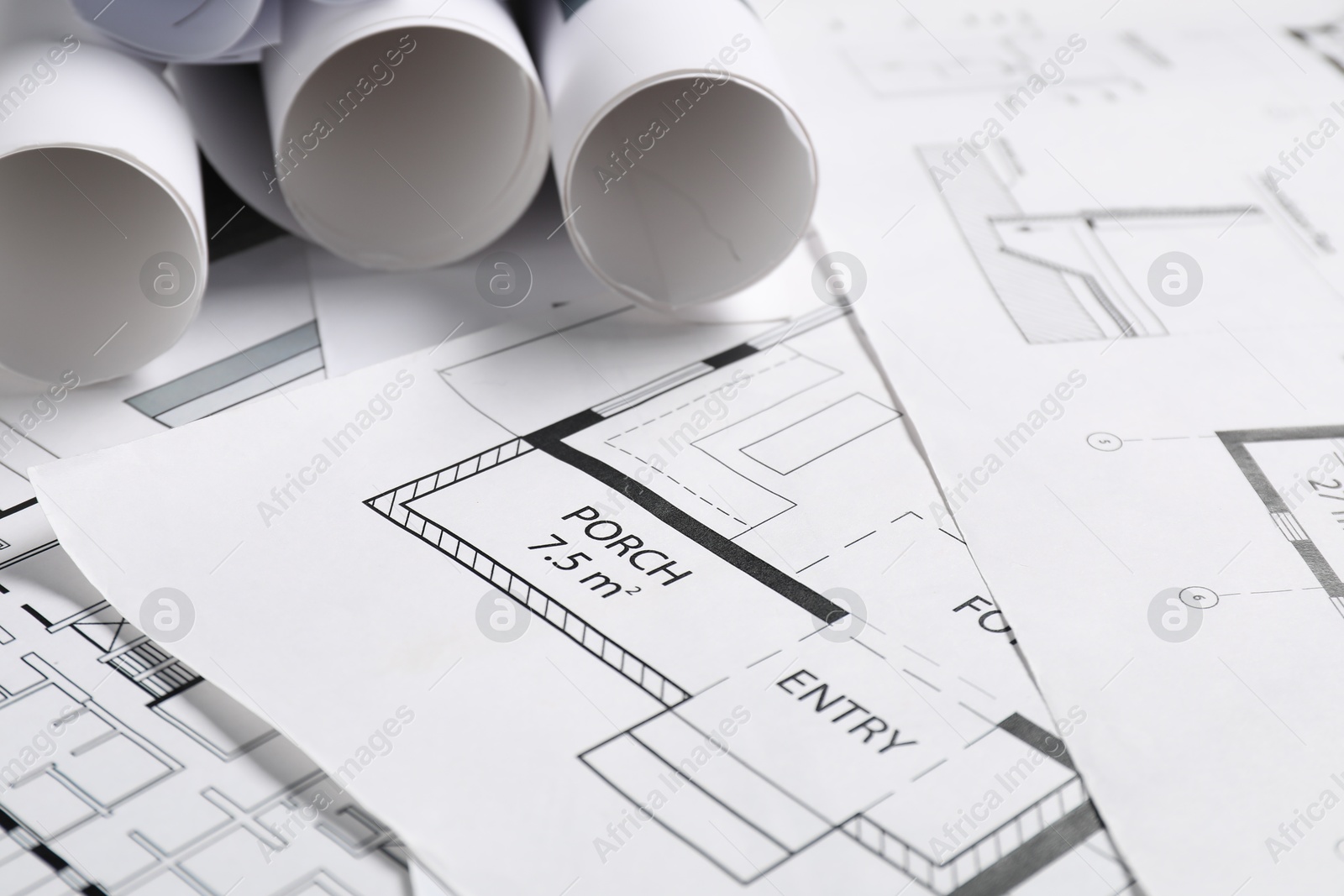 Photo of Different architectural drawings on table, closeup view