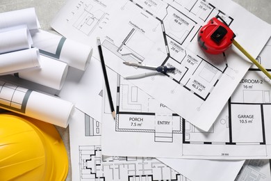 Photo of Different engineering drawings and tools on table, flat lay