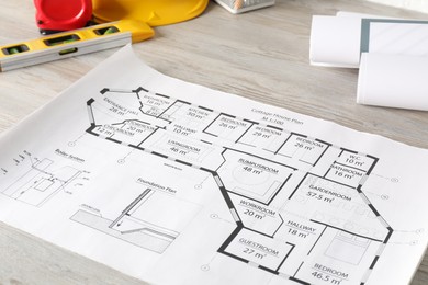 Photo of Different engineering drawings and tools on wooden table