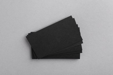 Photo of Blank business cards on grey background, top view. Mockup for design