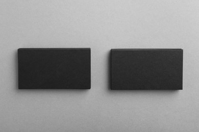 Photo of Blank business cards on grey background, top view. Mockup for design