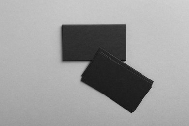 Photo of Blank business cards on grey background, top view. Mockup for design