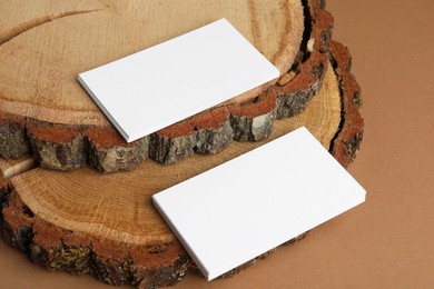 Photo of Blank business cards on brown background. Mockup for design