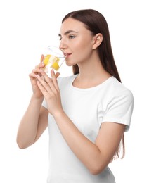 Photo of Woman drinking water with lemon on white background