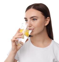 Photo of Woman drinking water with lemon on white background