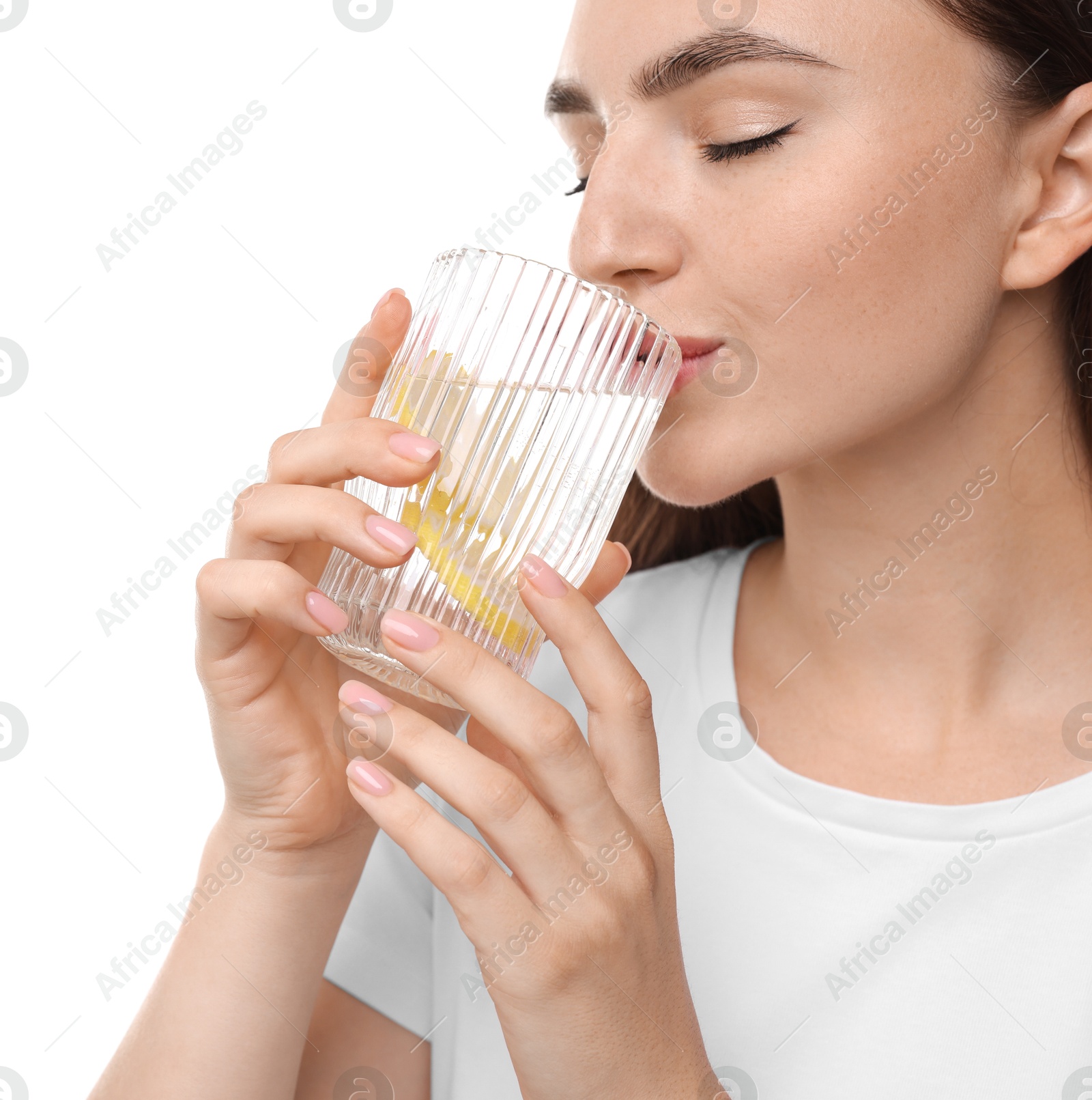 Photo of Woman drinking water with lemon on white background, closeup