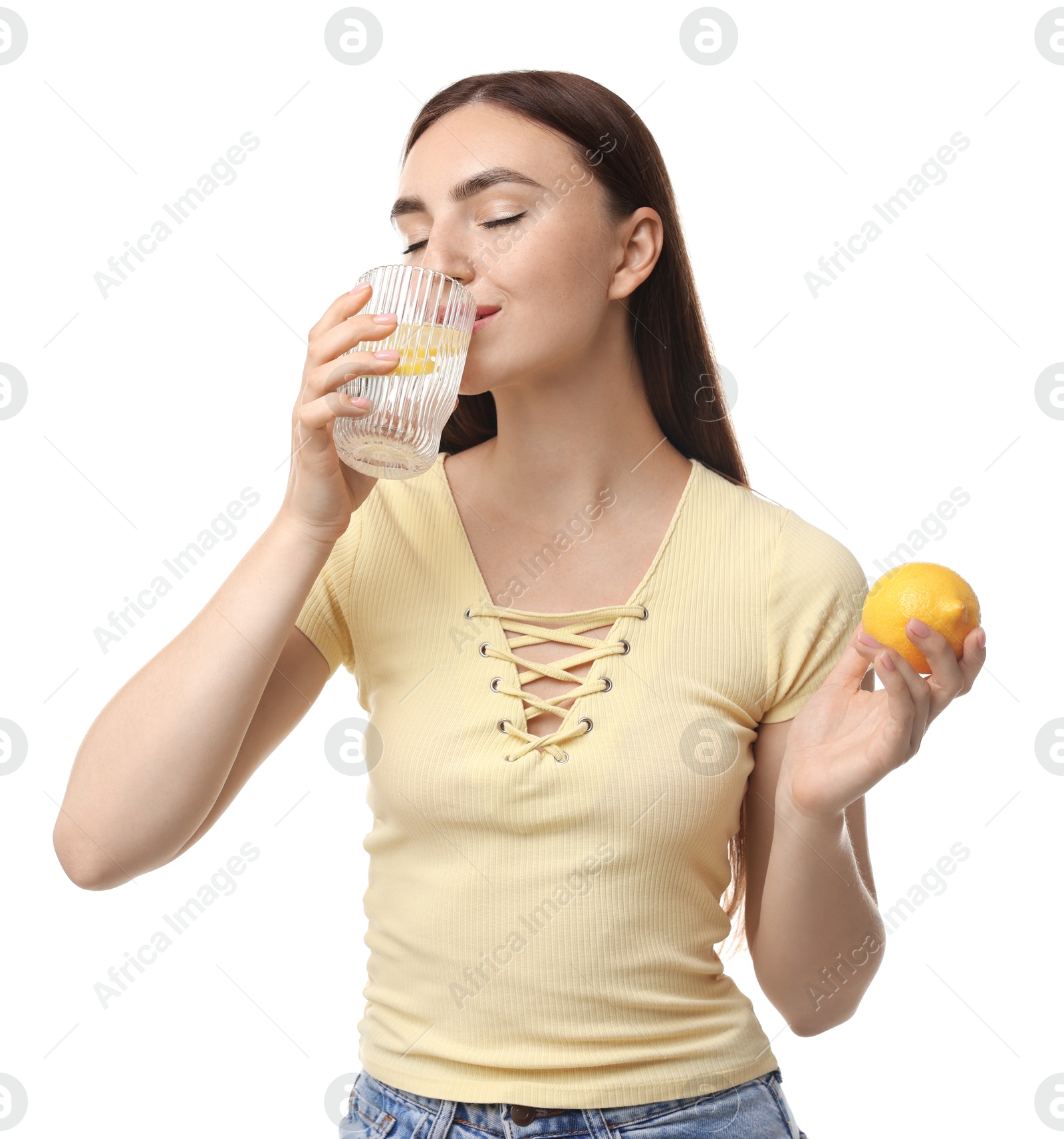 Photo of Woman drinking water with lemon on white background