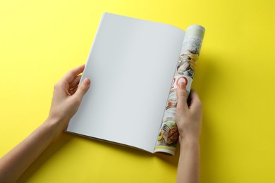 Woman reading magazine on yellow background, closeup. Mockup for design